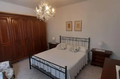 Letto o letti in una camera di Casa Elisa