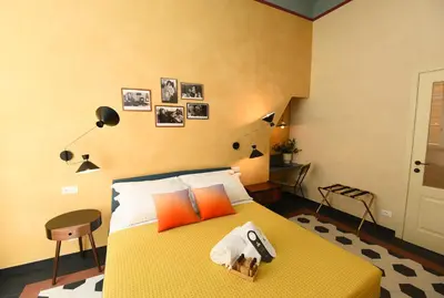 Letto o letti in una camera di Le stanze sopra i portici