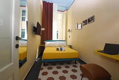 Letto o letti in una camera di Le stanze sopra i portici