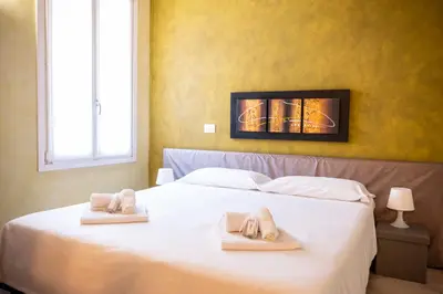 Letto o letti in una camera di Al Podestà - Centro Storico
