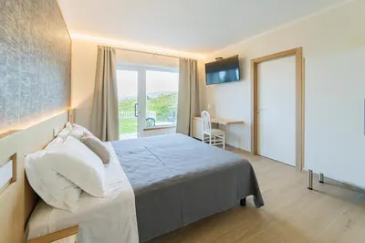 Letto o letti in una camera di B&B Lo Zefiro