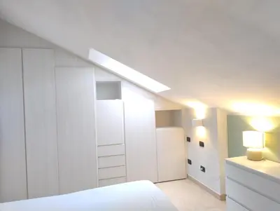 Letto o letti in una camera di Brezza di Mare Casa Vacanze