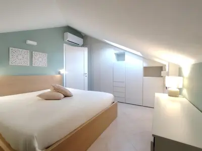 Letto o letti in una camera di Brezza di Mare Casa Vacanze