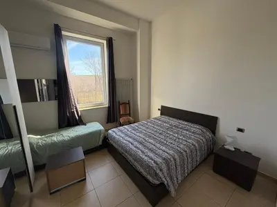 Letto o letti in una camera di Affittacamere Ami