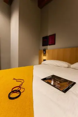 Letto o letti in una camera di Residenza San Longino
