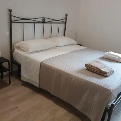 Letto o letti in una camera di Dalla Gina e Paolino B&B