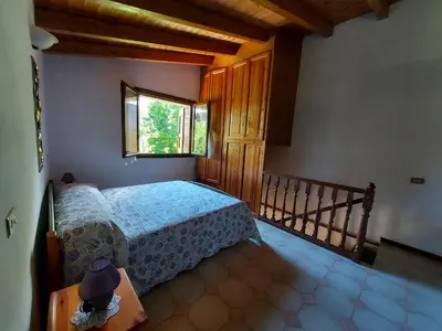 Letto o letti in una camera di IZZ1 Apartments - Loft Serramazzoni
