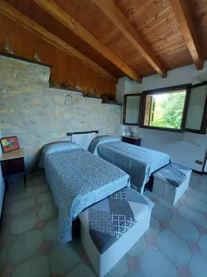 Letto o letti in una camera di IZZ1 Apartments - Loft Serramazzoni
