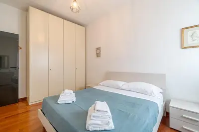 Letto o letti in una camera di GuestHost - Castagneto Holiday & Relax Apartment