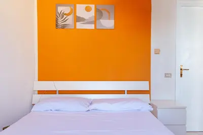 Letto o letti in una camera di peach apartment
