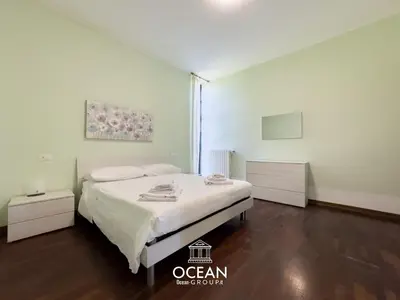 Letto o letti in una camera di Spaziosa Casa con parcheggio OceanGroupApartments