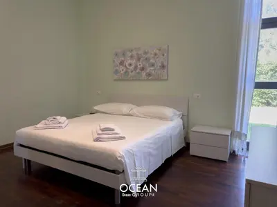Letto o letti in una camera di Spaziosa Casa con parcheggio OceanGroupApartments