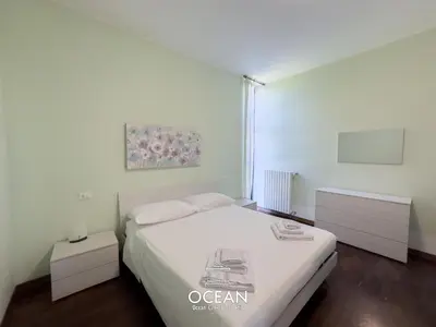 Letto o letti in una camera di Spaziosa Casa con parcheggio OceanGroupApartments