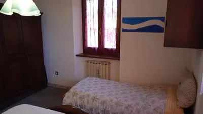 Letto o letti in una camera di La Pennica B&B