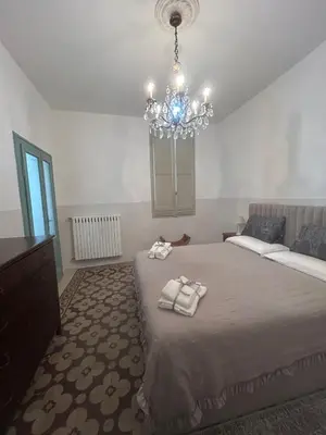 Letto o letti in una camera di Aporti Home