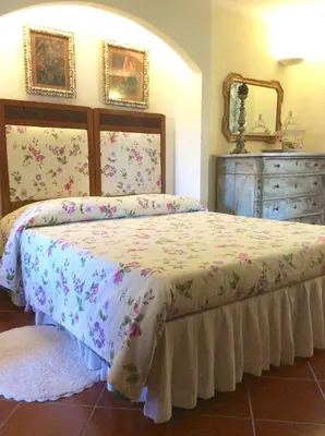Letto o letti in una camera di B&B Il Portico