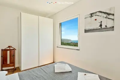 Letto o letti in una camera di Reborn House, TerreMarine