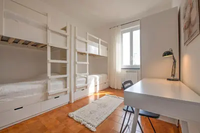 Letto o letti in una camera di Appartamento il Caruggio