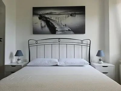 Letto o letti in una camera di Casa Arcobaleno - giardino e parcheggio gratuito