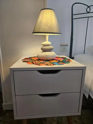 Letto o letti in una camera di Casa Arcobaleno - giardino e parcheggio gratuito