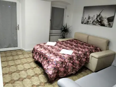 Letto o letti in una camera di Casa Arcobaleno - giardino e parcheggio gratuito