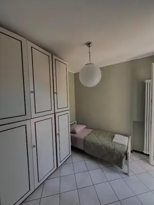 Letto o letti in una camera di Civico 21-FreeParking