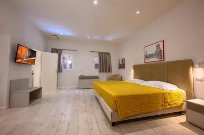 Letto o letti in una camera di San Giuseppe Apartments