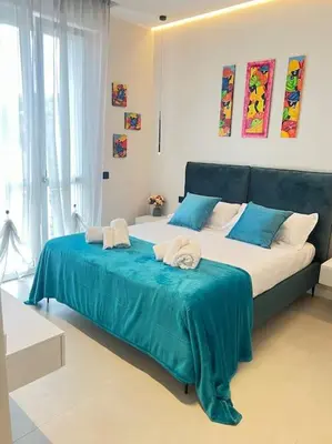 Letto o letti in una camera di UrbanSuite Il Nido Guest House