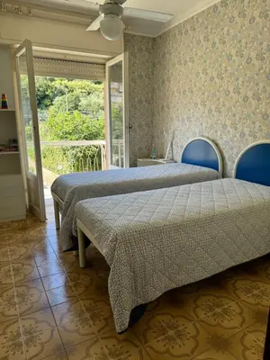 Letto o letti in una camera di casa degli ulivi