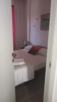 Letto o letti in una camera di Il Mare a un passo da casa SAMY appartamento intero 6 posti letto 60 mt