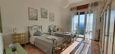 Letto o letti in una camera di Casa Vacanze Nonna Papera near Cinque Terre