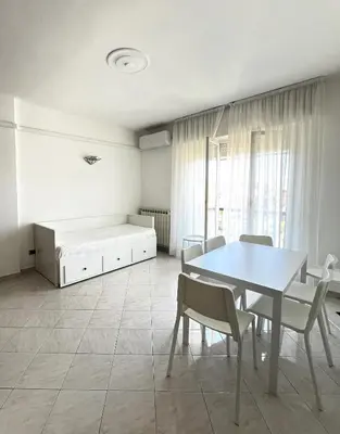 Letto o letti in una camera di Bilocale con parcheggio privato vicino la stazione