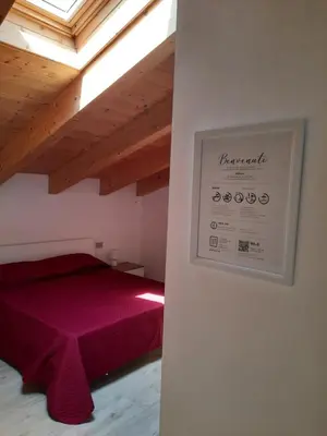 Letto o letti in una camera di La Macchia