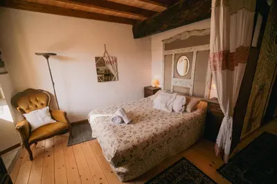 Letto o letti in una camera di Alloro casa storica