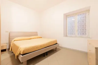 Letto o letti in una camera di Casa Dante