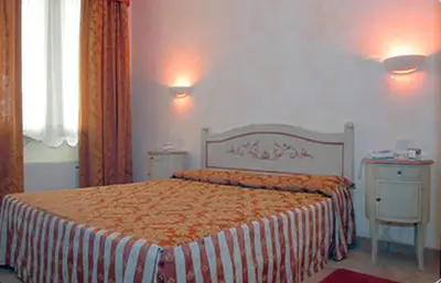 Letto o letti in una camera di Hotel Adda