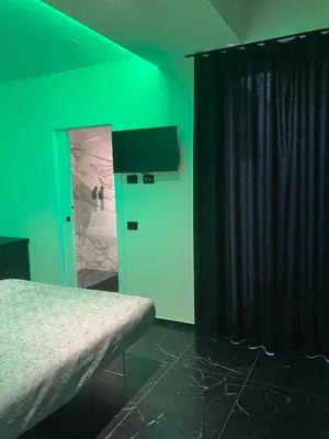 Letto o letti in una camera di Punto Zero Lux il primo boutique concept a Reggio Emilia