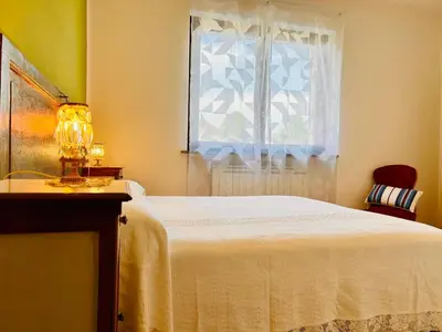 Letto o letti in una camera di L' altro nido