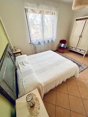 Letto o letti in una camera di L' altro nido