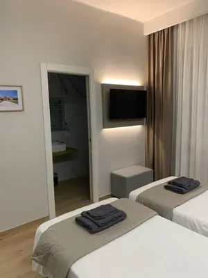 Letto o letti in una camera di Fla Rooms