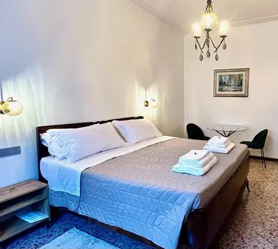 Letto o letti in una camera di Casa Margherita