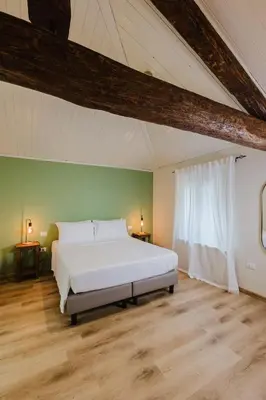 Letto o letti in una camera di Locanda sul fiume
