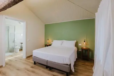 Letto o letti in una camera di Locanda sul fiume