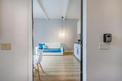Letto o letti in una camera di ViaEmilia 2 min dal centro, 4 Persone, WIFI, Aria condizionata