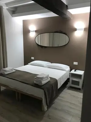 Letto o letti in una camera di Borgo Guazzo Flat