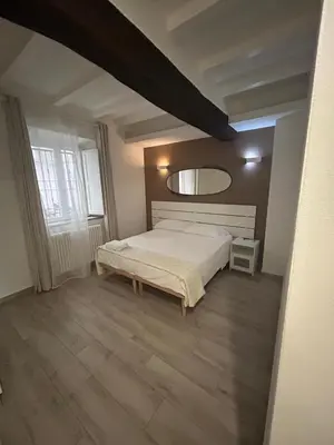 Letto o letti in una camera di Borgo Guazzo Flat