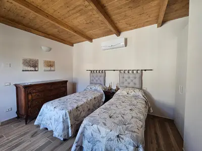 Letto o letti in una camera di Patrizio Apartments-by Goccia di Lago