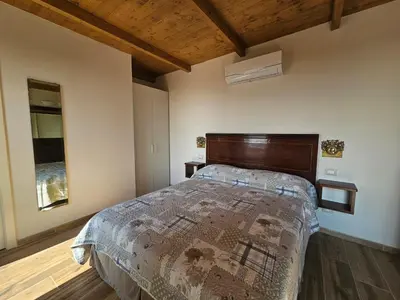 Letto o letti in una camera di Patrizio Apartments-by Goccia di Lago