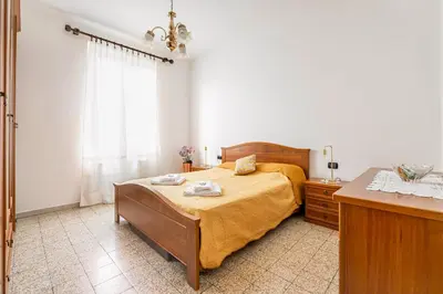 Letto o letti in una camera di GuestHost - Into the Green! Da Passano Apartment