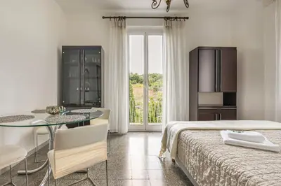 Letto o letti in una camera di GuestHost - Into the Green! Da Passano Apartment